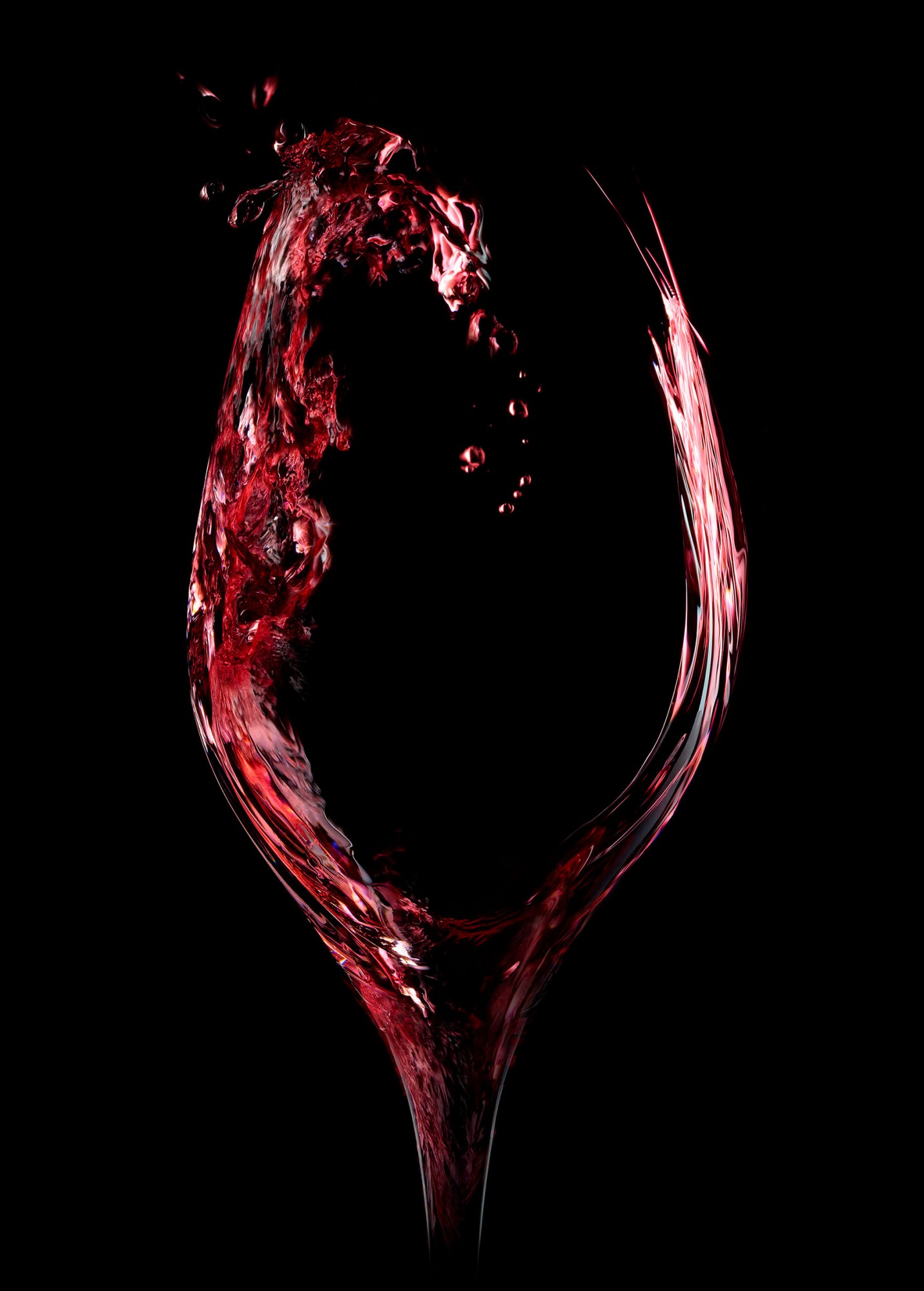 Verre de vin sur fond noir, photographie d'ambiance en studio à Lyon par Julien Bouvier