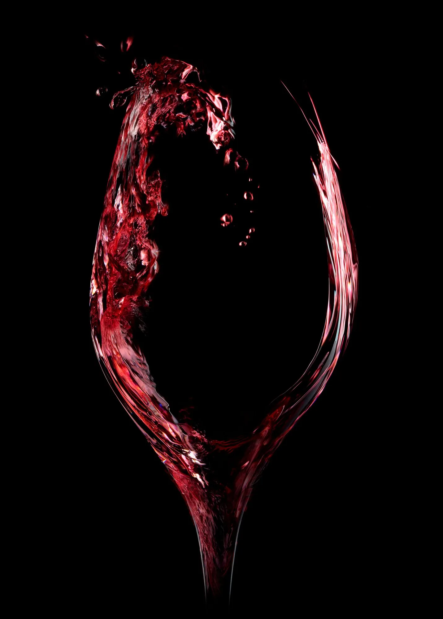 Verre de vin sur fond noir, photographie d'ambiance en studio à Lyon par Julien Bouvier